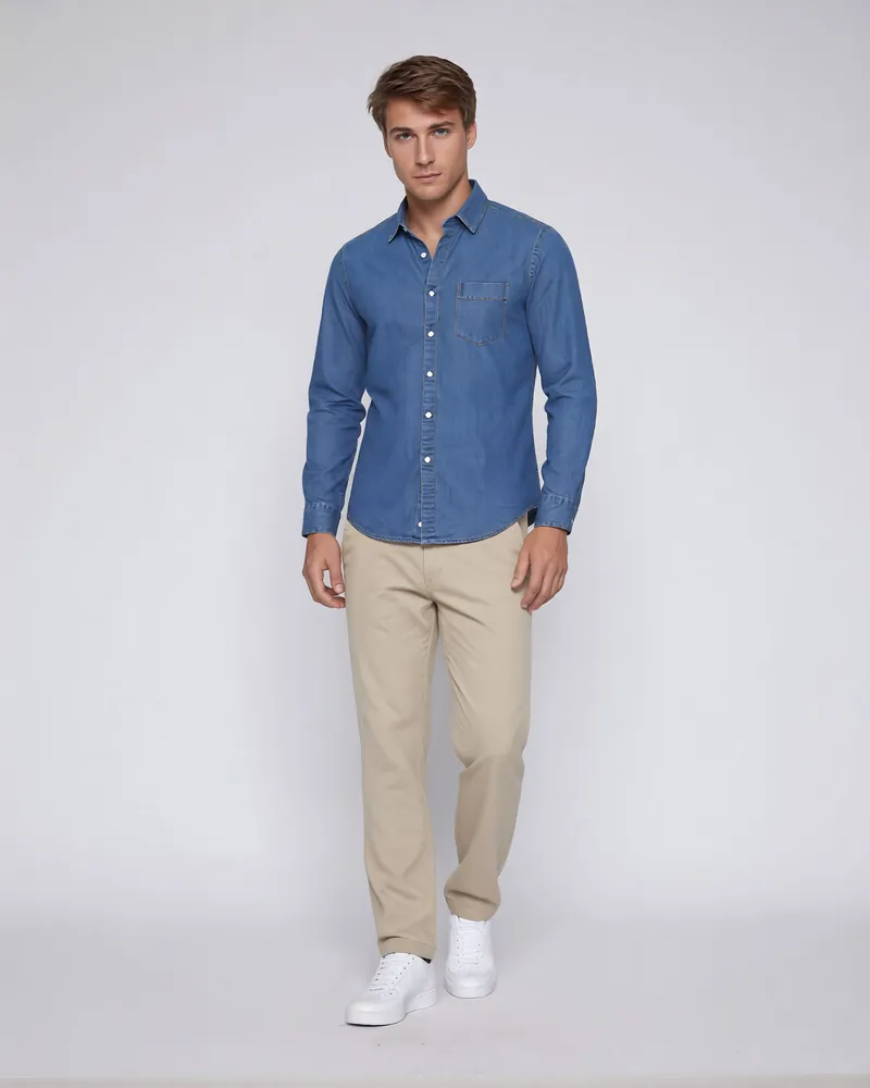 Male model in a denim shirt and beige chinos on a white studio background, AI ecommerce photography