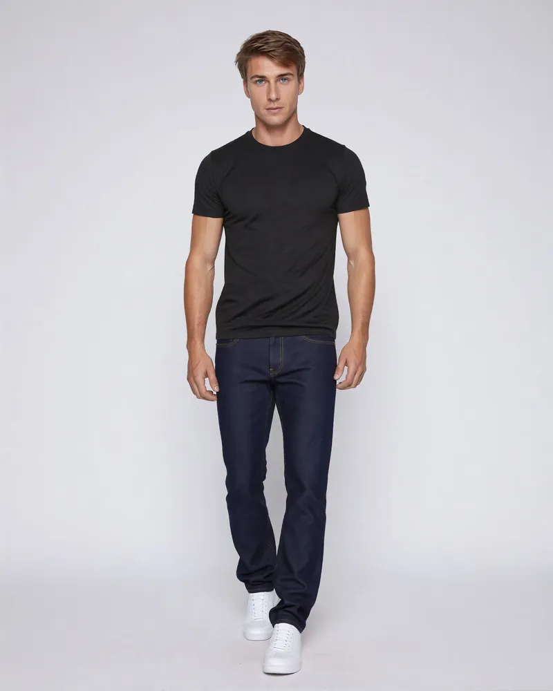 Male model in a black crew-neck T-shirt and jeans on white, AI PDP image